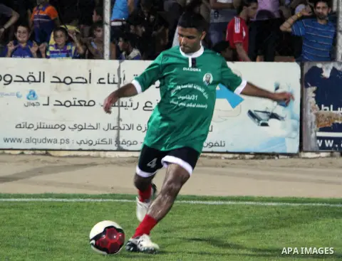 Mahmud Sarsak, Palestinian football player, plays with the team of al-Shijaia and Rafah Youth Club, in Yarmouk Stadium in Gaza city, on Oct. 02, 2012. Photo by Alaa Shamaly