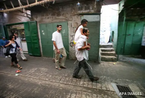 Jews shop at the market during the preparation for the celebration of Sukkot, the Feast of the Tabernacles, in in the West bank city of Hebron on Oct. 03, 2012. Temple before it was destroyed, perform a blessing ceremony...