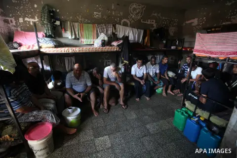 Palestinian prisoners sit in their cell in the Hamas-run Ansar prison in Gaza City on October 4, 2012. The jail holds prisoners convicted of all types of offenses. Human Rights Watch accused Gaza's ruling Hamas movement...