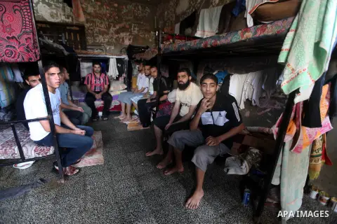 Palestinian prisoners sit in their cell in the Hamas-run Ansar prison in Gaza City on October 4, 2012. The jail holds prisoners convicted of all types of offenses. Human Rights Watch accused Gaza's ruling Hamas movement...