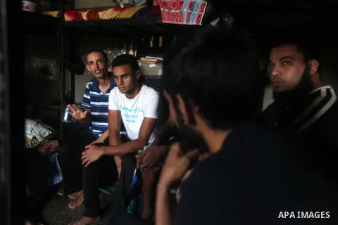 Palestinian prisoners sit in their cell in the Hamas-run Ansar prison in Gaza City on October 4, 2012. The jail holds prisoners convicted of all types of offenses. Human Rights Watch accused Gaza's ruling Hamas movement...