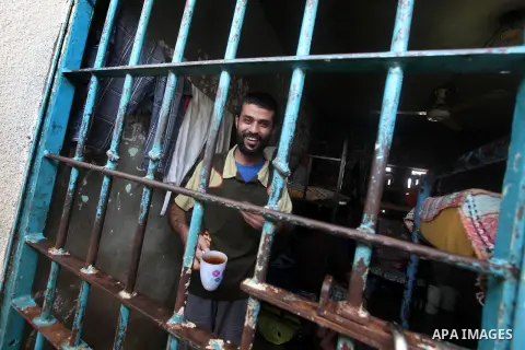 Palestinian prisoners sit in their cell in the Hamas-run Ansar prison in Gaza City on October 4, 2012. The jail holds prisoners convicted of all types of offenses. Human Rights Watch accused Gaza's ruling Hamas movement...