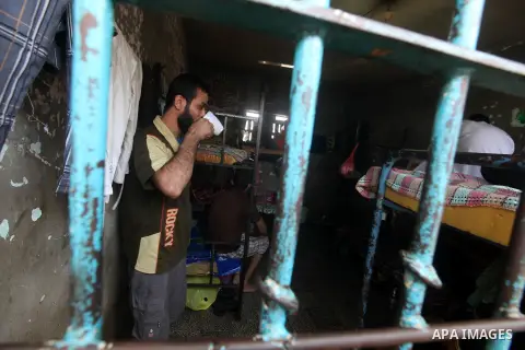Palestinian prisoners sit in their cell in the Hamas-run Ansar prison in Gaza City on October 4, 2012. The jail holds prisoners convicted of all types of offenses. Human Rights Watch accused Gaza's ruling Hamas movement...