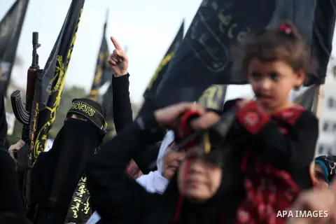 Female Islamic Jihad militants take part in a ceremony marking the 25th anniversary of the movement's establishment and the 17th anniversary of the death of the group's leader Fathi Shekaki in Gaza City October 4, 2012....