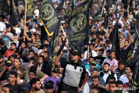 Palestinian supporters of Islamic Jihad movement take part in a ceremony marking the 25th anniversary of the movement's establishment and the 17th anniversary of the death of the group's leader Fathi Shekaki in Gaza City...