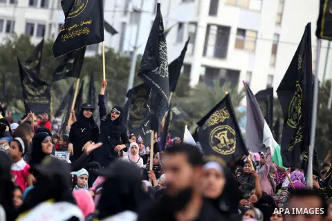 Palestinian supporters of Islamic Jihad movement take part in a ceremony marking the 25th anniversary of the movement's establishment and the 17th anniversary of the death of the group's leader Fathi Shekaki in Gaza City...