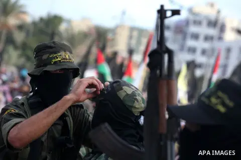 Islamic Jihad militants stand guard during a ceremony marking the 25th anniversary of the movement's foundation and the 17th anniversary of the death of the group's leader Fathi Shekaki in Gaza City October 4, 2012. Phot...
