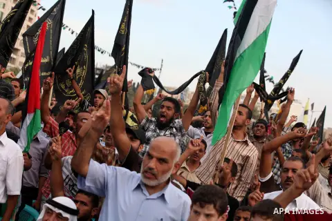 Palestinian supporters of Islamic Jihad movement take part in a ceremony marking the 25th anniversary of the movement's foundation and the 17th anniversary of the death of the group's leader Fathi Shekaki in Gaza City Oc...