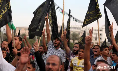 Palestinian supporters of Islamic Jihad movement take part in a ceremony marking the 25th anniversary of the movement's foundation and the 17th anniversary of the death of the group's leader Fathi Shekaki in Gaza City Oc...