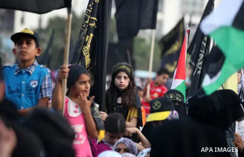 Palestinian supporters of Islamic Jihad movement take part in a ceremony marking the 25th anniversary of the movement's foundation and the 17th anniversary of the death of the group's leader Fathi Shekaki in Gaza City Oc...
