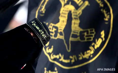 A Palestinian female supporter of Islamic Jihad movement takes part in a ceremony marking the 25th anniversary of the movement's foundation and the 17th anniversary of the death of the group's leader Fathi Shekaki in Gaz...
