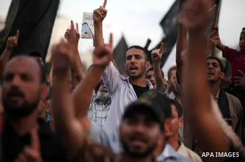 Palestinian supporters of Islamic Jihad movement take part in a ceremony marking the 25th anniversary of the movement's foundation and the 17th anniversary of the death of the group's leader Fathi Shekaki in Gaza City Oc...
