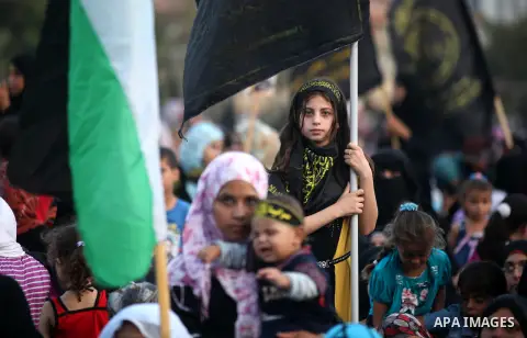 Palestinian supporters of Islamic Jihad movement take part in a ceremony marking the 25th anniversary of the movement's foundation and the 17th anniversary of the death of the group's leader Fathi Shekaki in Gaza City Oc...