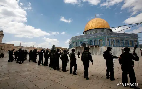 Israeli riot policemen take position near the Dome of the Rock during clashes at the Al Aqsa Mosque compound, known by the Jews as the Temple Mount, in Jerusalem's Old City, Friday, Oct. 5, 2012. Earlier this week, hardl...