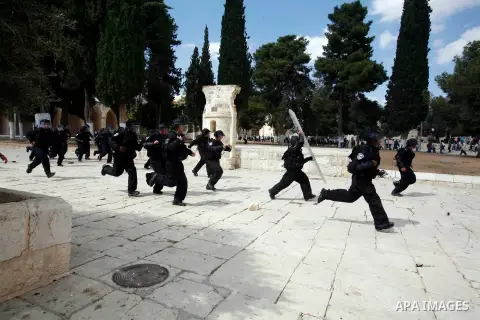 Israeli riot police run after Palestinian worshippers during clashes at the Al Aqsa Mosque compound, known by the Jews as the Temple Mount, in Jerusalem's Old City, Friday, Oct. 5, 2012. Earlier this week, hardline Jewis...