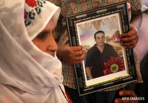 Palestinian women hold pictures of their relatives prisoners held in Israeli jails during a protest calling for their release in front of the red cross office in Gaza city October 08, 2012 . Photo by Majdi Fathi