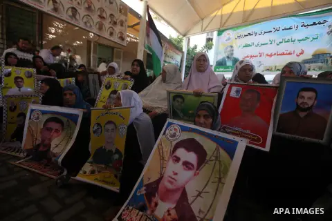 Palestinian women hold pictures of their relatives prisoners held in Israeli jails during a protest calling for their release in front of the red cross office in Gaza city October 08, 2012 . Photo by Majdi Fathi