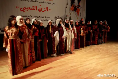 Palestinian girls wear folk costumes during a traditional costumes show in the West Bank city of Nablus, Oct. 09, 2012. Traditional Palestinian costumes reflected a woman's economic and marital status and her town or dis...