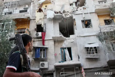 Syrians inspect damages in the old city of Aleppo after the area was shelled by Syrian regime forces on September 08 2012. Forces loyal to President Bashar al-Assad shelled rebel-held areas across Syria as fierce clashes...