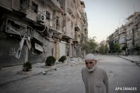 Syrians inspect damages in the old city of Aleppo after the area was shelled by Syrian regime forces on September 08 2012. Forces loyal to President Bashar al-Assad shelled rebel-held areas across Syria as fierce clashes...