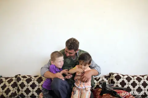 Abu Muhamed, A free Syrian army fighter with his kids before join the FSA Army in the city of Aleppo, September 11, 2012. Photo by Ahmed Deeb