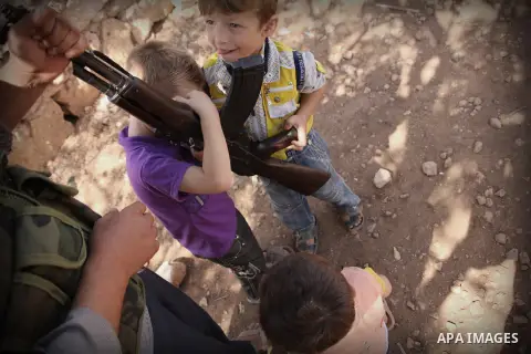 Abu Muhamed, A free Syrian army fighter with his kids before join the FSA Army in the city of Aleppo, September 11, 2012. Photo by Ahmed Deeb