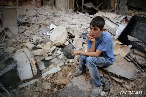 Syrians inspect damages in the old city of Aleppo after the area was shelled by Syrian regime forces on September 12, 2012. Forces loyal to President Bashar al-Assad shelled rebel-held areas across Syria as fierce clashe...
