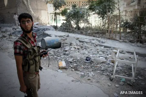 Syrians inspect damages in the old city of Aleppo after the area was shelled by Syrian regime forces on September 12, 2012. Forces loyal to President Bashar al-Assad shelled rebel-held areas across Syria as fierce clashe...