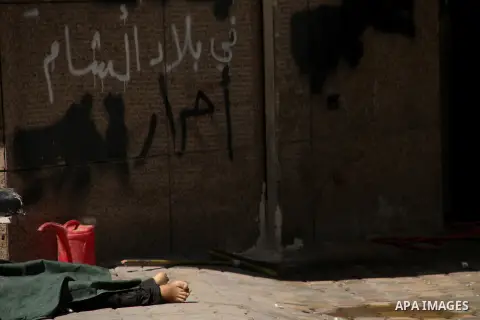 A dead Syrian man in the city of Aleppo after the area was shelled by Syrian regime forces on September 12 2012. Forces loyal to President Bashar al-Assad shelled rebel-held areas across Syria as fierce clashes were repo...
