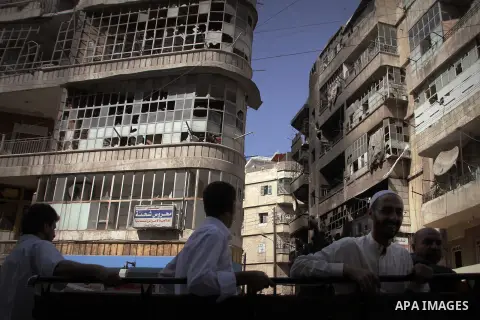 Syrians inspect damages in the old city of Aleppo after the area was shelled by Syrian regime forces on September 12, 2012. Forces loyal to President Bashar al-Assad shelled rebel-held areas across Syria as fierce clashe...