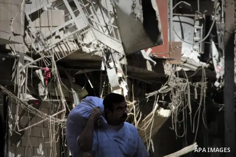 Syrians inspect damages in the old city of Aleppo after the area was shelled by Syrian regime forces on September 12, 2012. Forces loyal to President Bashar al-Assad shelled rebel-held areas across Syria as fierce clashe...