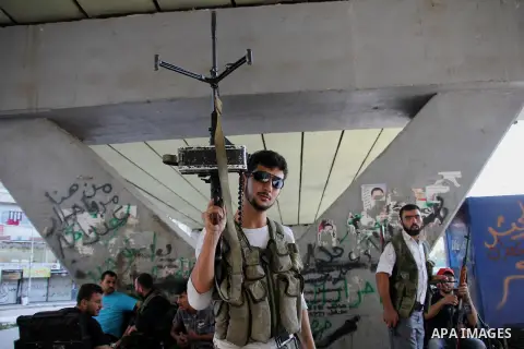 Free Syrian army survey the situation in Aleppo, Syria, September 12, 2012. Syrian FSA have vowed to retake control of the large Hanano army base in Aleppo, a few days after loosing control of it to Syrian government for...