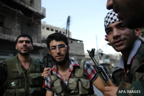 Free Syrian army survey the situation in Aleppo, Syria, September 12, 2012. Syrian FSA have vowed to retake control of the large Hanano army base in Aleppo, a few days after loosing control of it to Syrian government for...