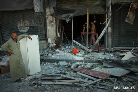 Syrians inspect damages in the old city of Aleppo after the area was shelled by Syrian regime forces on September 12, 2012. Forces loyal to President Bashar al-Assad shelled rebel-held areas across Syria as fierce clashe...