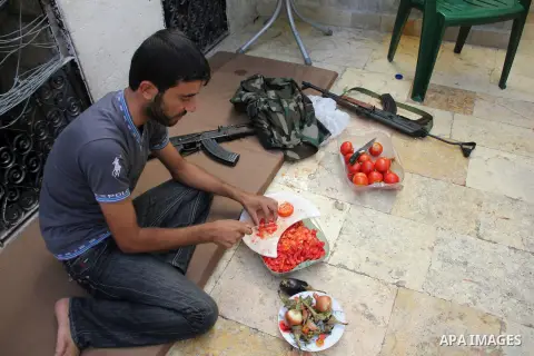 Free Syrian Army prepares dinner after clashes with regime forces in Aleppo in northern Syria on September 16, 2012. Photo by Ahmed Deeb