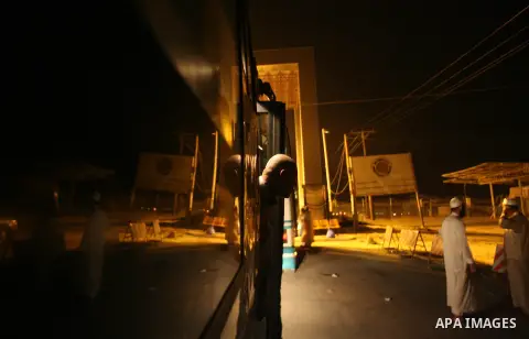 Palestinian pilgrims sit in buses as they wait to cross the Rafah border crossing into Egypt , in the southern Gaza Strip town of Rafah on Oct. 09, 2012 . Hundreds of Palestinian pilgrims crossed into Egypt on their way...