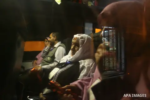 Palestinian pilgrims sit in buses as they wait to cross the Rafah border crossing into Egypt , in the southern Gaza Strip town of Rafah on Oct. 09, 2012 . Hundreds of Palestinian pilgrims crossed into Egypt on their way...