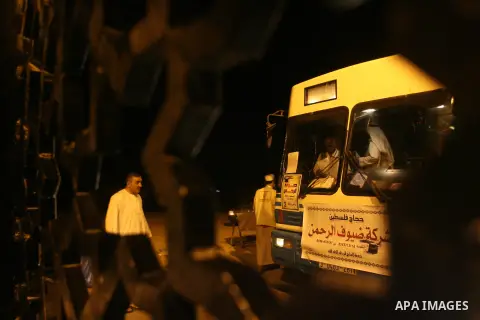 Palestinian pilgrims sit in buses as they wait to cross the Rafah border crossing into Egypt , in the southern Gaza Strip town of Rafah on Oct. 09, 2012 . Hundreds of Palestinian pilgrims crossed into Egypt on their way...
