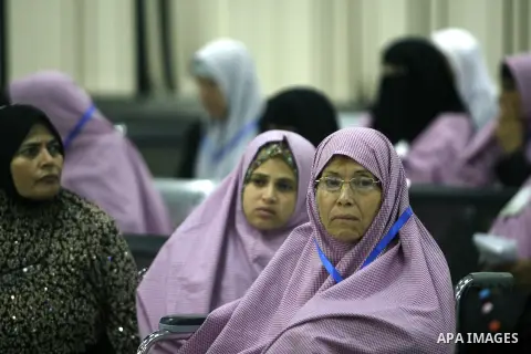 Palestinian pilgrims wait at a hall after they cross the Rafah border crossing into Gaza Strip, in the southern Gaza strip town of Rafah on Oct. 09, 2012. Hundreds of Palestinian pilgrims will cross into Gaza Strip on th...