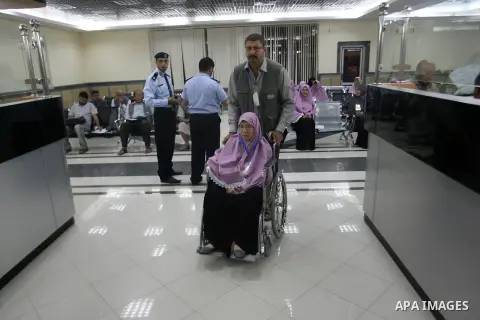 Palestinian pilgrims wait at a hall after they cross the Rafah border crossing into Gaza Strip, in the southern Gaza strip town of Rafah on Oct. 09, 2012. Hundreds of Palestinian pilgrims will cross into Gaza Strip on th...