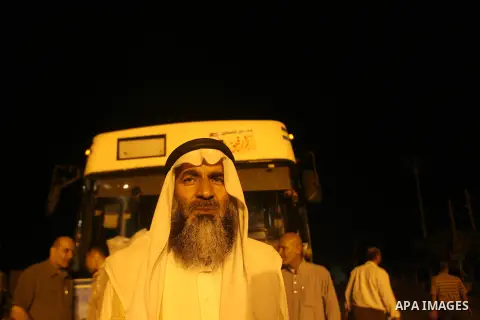 Palestinian pilgrims sit in buses as they wait to cross the Rafah border crossing into Egypt , in the southern Gaza Strip town of Rafah on Oct. 09, 2012 . Hundreds of Palestinian pilgrims crossed into Egypt on their way...