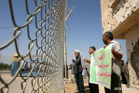 Palestinians participate a protest against Israeli siege imposed on Gaza strip during a rally in Rafah in the southern Gaza Strip, on Oct. 10, 2012. Photo by Eyad Al Baba