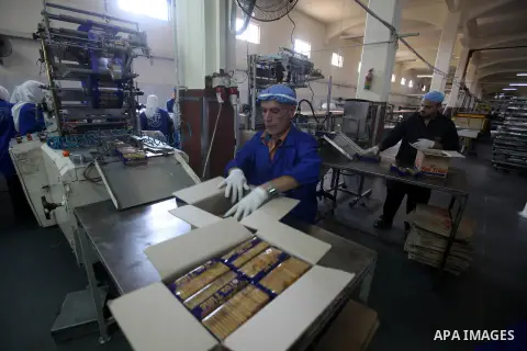 Palestinian workers quality control biscuits at the al-Awda factory in Deir al-Balah, in the central Gaza strip, on October 10, 2012. The World Food Program (WFP) will export the biscuits to United Nation run schools in...
