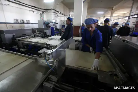 Palestinian workers quality control biscuits at the al-Awda factory in Deir al-Balah, in the central Gaza strip, on October 10, 2012. The World Food Program (WFP) will export the biscuits to United Nation run schools in...
