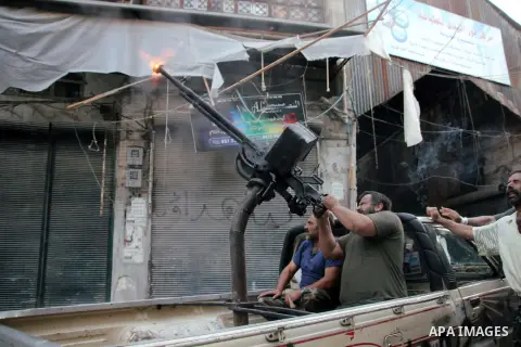 Free Syrian Army fires an anti-aircraft heavy machine gun at an army MiG-23 conducting raids on the in the old city of Aleppo on September 19. 2012. Photo by Ahmed Deeb