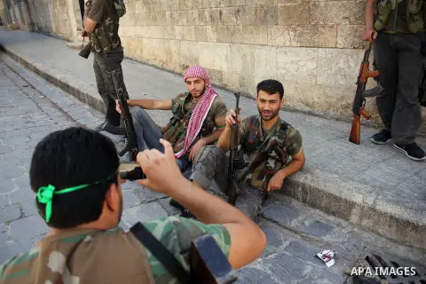 Free Syrian Army take position during clashes with regime forces near the old city market in Aleppo in northern Syria on September 20, 2012. Photo by Ahmed Deeb