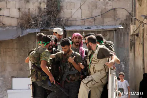 Free Syrian Army take position during clashes with regime forces near the old city market in Aleppo in northern Syria on September 20, 2012. Photo by Ahmed Deeb
