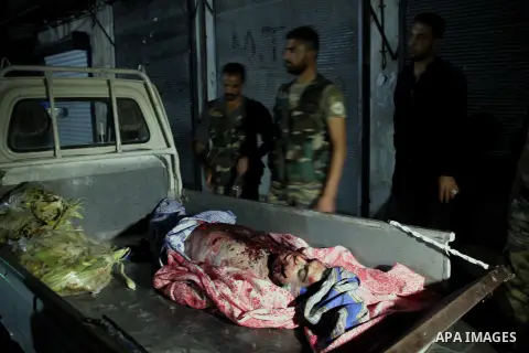 A dead Syrian man in al-Hazazeh neighborhood in the old city of Aleppo after the area was shelled by Syrian regime forces on September 22 2012. Photo by Ahmed Deeb