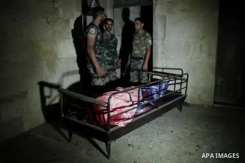 A dead Syrian man in al-Hazazeh neighborhood in the old city of Aleppo after the area was shelled by Syrian regime forces on September 22 2012. Photo by Ahmed Deeb