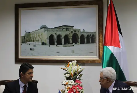 Palestinian President Mahmoud Abbas (R) meets with Romanian Foreign Minister Titus Corlatean (L) in the West Bank city of Ramallah, Oct. 10, 2011. Corlatean is on an official visit to the region. Photo by Issam Rimawi